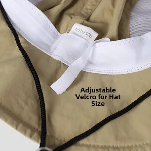 Detail view of khaki nylon hiking hat featuring mesh lining and adjustable velcro strap