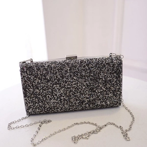 Sparkling black rhinestone evening clutch bag with silver metal frame and chain strap