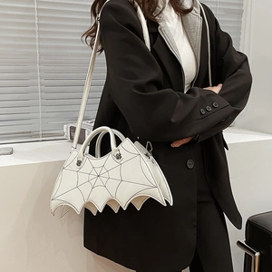 Detail of white bat wing handbag with spider web stitching and detachable PU shoulder strap