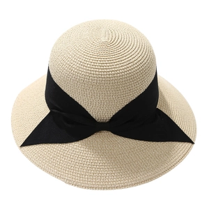 Elegant beige wide brim straw sun hat with a large black bow for summer UV protection