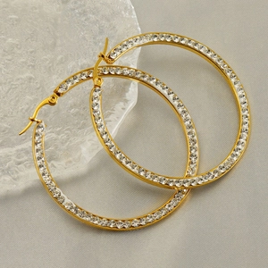 Detail of 18k gold plated hoop earrings featuring a full micro-pave diamond setting