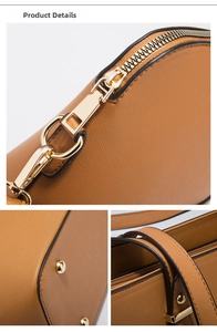 Detail view of camel cross-grain faux leather bag with gold hardware and zippers