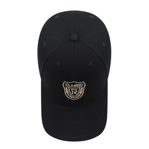 Classic black baseball cap with embroidered shield patch for a casual retro sports style