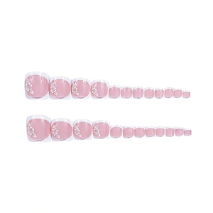 Short square press-on toenails with pink base, white French tips and flower patterns