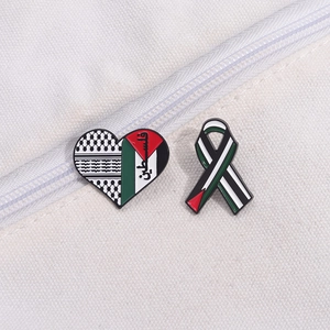 Minimalist Palestine heart and ribbon enamel pin badges with flag colors on white canvas