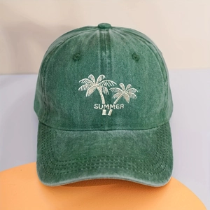 Detail of embroidered coconut trees and Summer text on washed green baseball cap