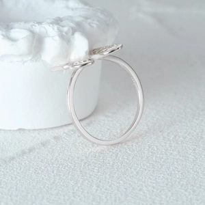 Close-up of S925 sterling silver butterfly ring showing the hollow wing design and S925 stamp