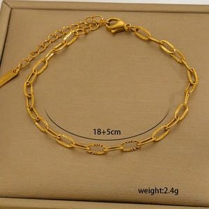 Detail of 18K gold plated stainless steel paperclip chain bracelet with lobster clasp and extender