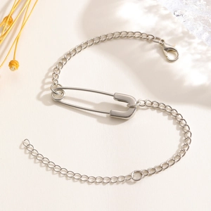 Detail shot of a silver paperclip pendant necklace with chain and lobster clasp closure