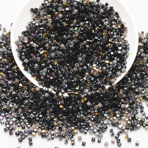 Macro shot of glossy black glass cube beads for DIY jewelry and handmade accessories