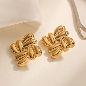 Golden butterfly geometric stainless steel stud earrings on elegant silk background
