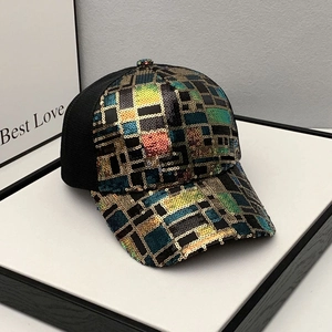 Detail of sequined rainbow baseball cap showing breathable mesh and colorful design