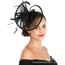 Detail of elegant black mesh veil hat with feathers for wedding tea party events