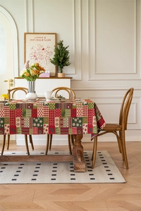 Detailed pattern of a Christmas tablecloth with gingerbread men and snowflakes