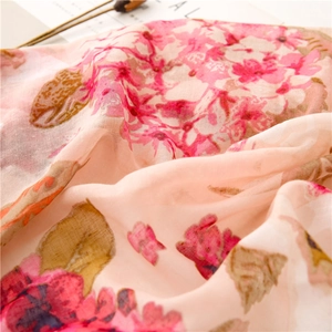 Detailed macro shot of vintage pink floral pattern on soft cotton-linen blend fabric