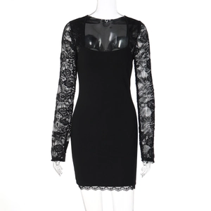 Detailed view of black slim fit dress featuring intricate lace patchwork on sleeves