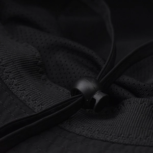 Close-up of the black outdoor hat showing breathable mesh lining and adjustable drawstring