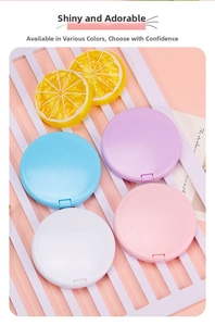 Macro detail of portable macaron makeup mirrors in blue, purple, white and pink colors