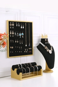 Set of black velvet jewelry display stands with gold frames for earrings and necklaces