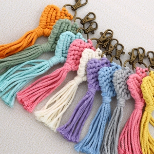 Handmade heart-shaped woven cotton keychains with bronze lobster clasps in nine colors