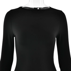Detail shot of black slim-fit crew neck long sleeve dress with elastic texture