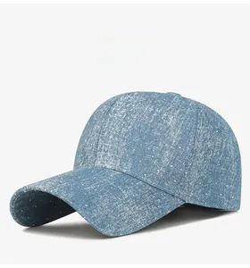 Side view of blue tie-dye denim baseball cap featuring white speckled wash finish