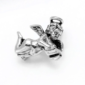 Macro shot of silver angel brooch showing vintage texture and artistic metal details