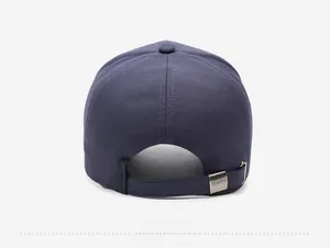 Detail view of the navy blue cotton baseball cap back with adjustable metal buckle strap