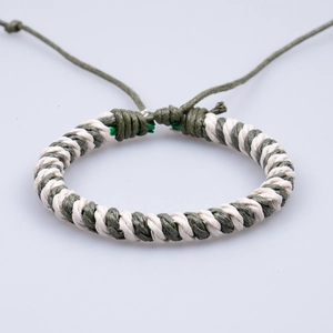 Adjustable woven rope bracelet in olive green and cream white with textured knot detail