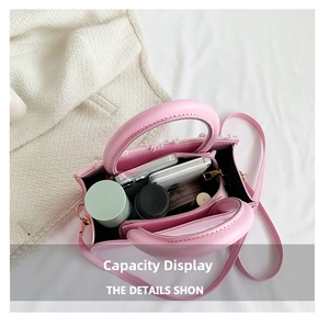 Top view detail of pink leather tote bag with multi-compartment interior for daily essentials