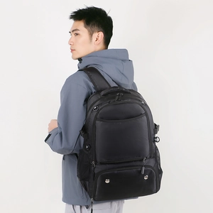 Side view of black water-resistant sports backpack with breathable straps and mesh pockets