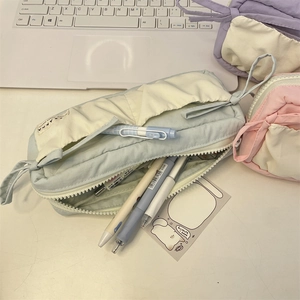 Desktop view of the light blue multi-layer stationery pouch with large capacity storage