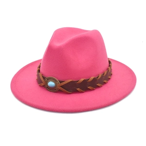 Close-up of pink wool fedora with woven leather band and turquoise metal buckle