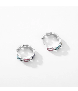 Macro view of S925 silver link earrings with colorful pink and purple enamel details