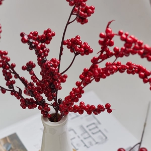 Vivid red artificial berries branch for Christmas tree decoration and home floral arrangement