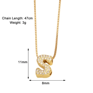 Detail view of gold letter S pendant with zircon inlay and product size specifications