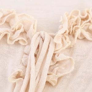 Women's ruffle knit top in beige with delicate drawstring and pleated mesh details