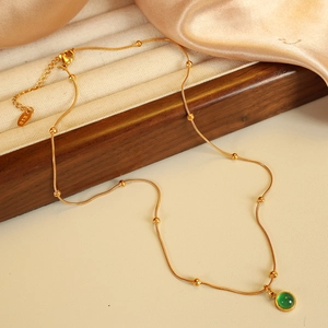 French vintage necklace with green stone pendant and 18K gold-plated snake chain