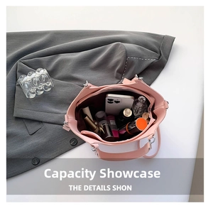 Interior view of the pink leather bucket bag showing storage for phone and cosmetics