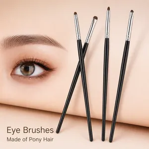 Detail of 4-piece professional eye makeup brushes with soft pony hair and black handles