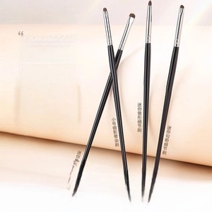 Detail of 4-piece professional eye makeup brushes with soft pony hair and black handles