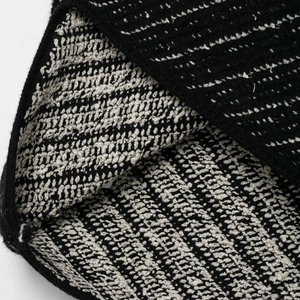 Women's chic knit two-piece set featuring textured black and beige woven tweed fabric
