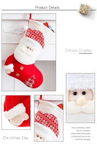 Detail of red and white knitted Santa Claus Christmas stocking with hanging loop