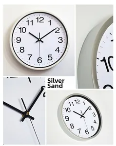 Detail of silver sand quartz wall clock showing aluminum frame and Arabic numerals