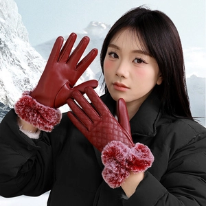 Red PU leather women's gloves with plush cuffs and diamond stitch pattern in snow