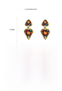 Detail showing vintage triangle earrings size 7.5cm by 3.2cm with weight specifications