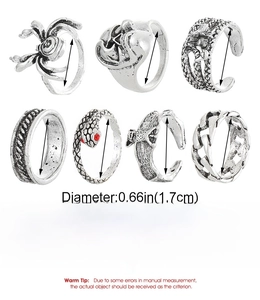 Detailed view of 7-piece vintage gothic ring set featuring spider skull and snake motifs