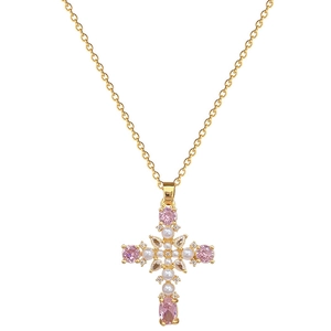 Titanium gold cross necklace with pink stones, pearls and crystals on white background