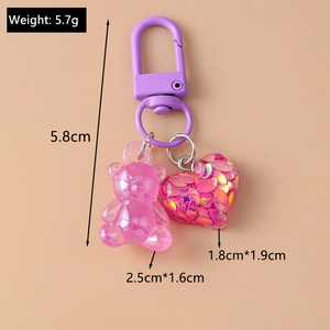 Detailed dimensions of pink bear and heart keychain showing 5.8cm length and 5.7g weight