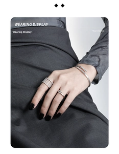 Wearing display of silver hollow rings and sparkling diamond bracelet on hands